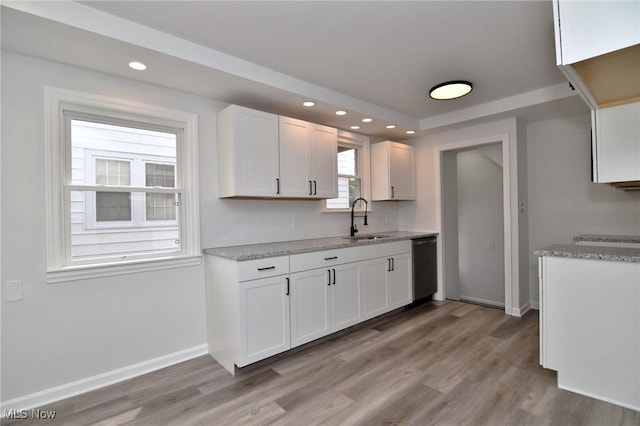 3890 Grosvenor Rd, South Euclid, OH 44118 - kitchen with a sink, dishwasher, white cabinetry, light wood-style flooring, and recessed lighting