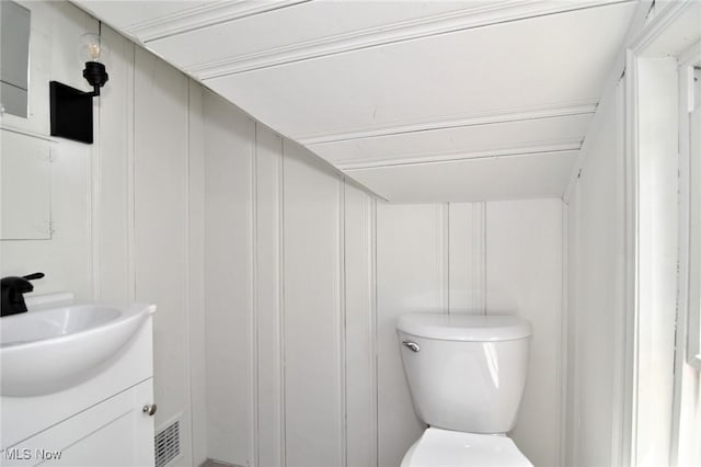 3890 Grosvenor Rd, South Euclid, OH 44118 - bathroom featuring toilet, a decorative wall, and vanity