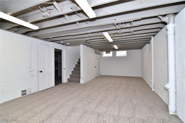 3890 Grosvenor Rd, South Euclid, OH 44118 - below grade area with stairway and carpet floors