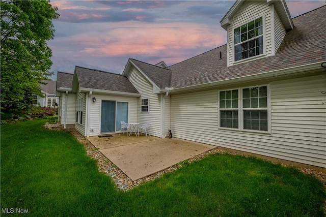 3347 Reserve Dr Unit 36, Cuyahoga Falls, OH 44223 - back of house featuring a yard, a patio area, and a shingled roof