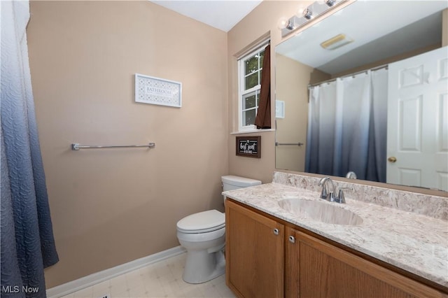 3347 Reserve Dr Unit 36, Cuyahoga Falls, OH 44223 - bathroom featuring toilet, vanity, tile patterned floors, and baseboards
