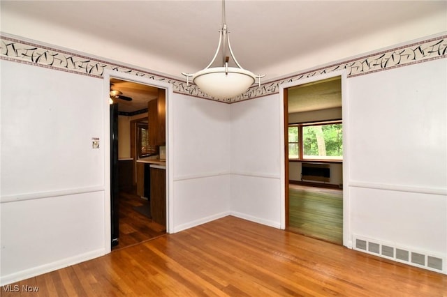 3927 Princeton Blvd, South Euclid, OH 44121 - unfurnished dining area featuring wood finished floors and baseboards