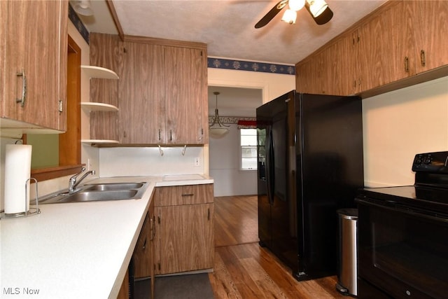 3927 Princeton Blvd, South Euclid, OH 44121 - kitchen featuring black appliances, a sink, ceiling fan, light countertops, and dark wood finished floors