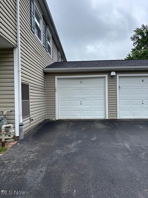 221 Canterbury Unit A38, Medina, OH 44256 - garage featuring driveway