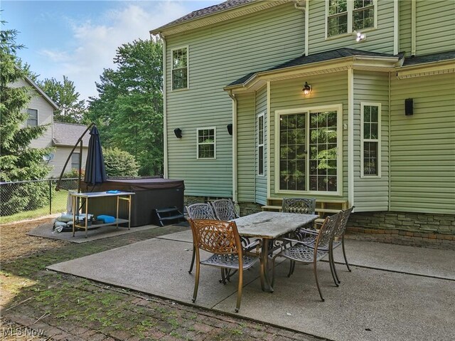 7234 Bridlewood Dr, Concord, OH 44077 - view of patio / terrace featuring a hot tub and outdoor dining space