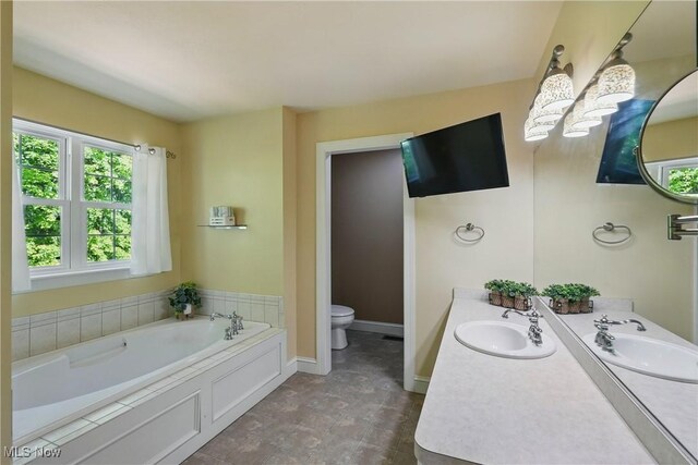 7234 Bridlewood Dr, Concord, OH 44077 - bathroom with a bath, toilet, and double vanity