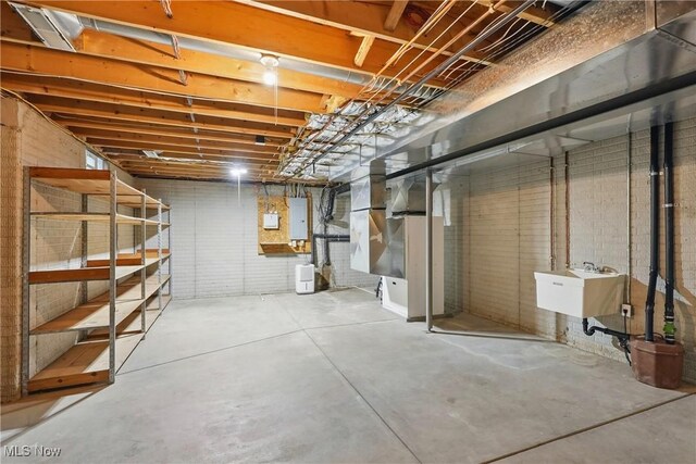 7234 Bridlewood Dr, Concord, OH 44077 - unfinished basement with electric panel and a sink
