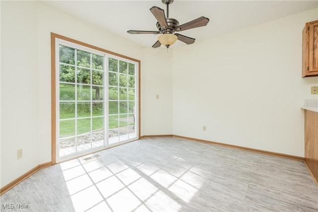 10237 Middlebranch Ave NE, Hartville, OH 44632 - spare room with baseboards, a ceiling fan, and light colored carpet