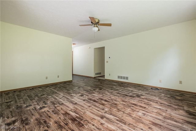 10237 Middlebranch Ave NE, Hartville, OH 44632 - unfurnished room with wood finished floors, ceiling fan, and baseboards