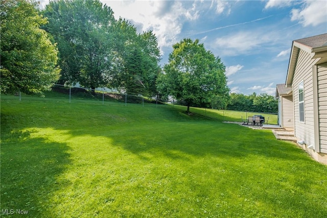 10237 Middlebranch Ave NE, Hartville, OH 44632 - view of yard featuring a patio and view of wooded area