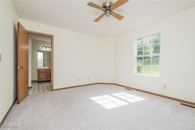 10237 Middlebranch Ave NE, Hartville, OH 44632 - carpeted spare room with baseboards and a ceiling fan