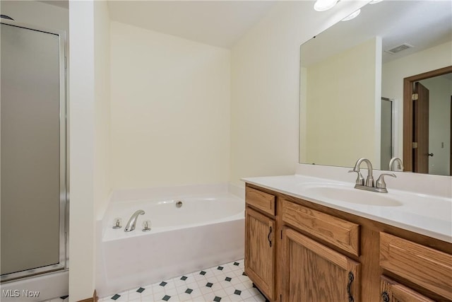10237 Middlebranch Ave NE, Hartville, OH 44632 - bathroom featuring vanity, a stall shower, a garden tub, and tile patterned floors