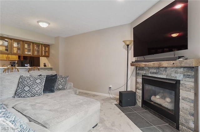 2426 Wrens Dr S, Stow, OH 44224 - carpeted living room with a fireplace and baseboards
