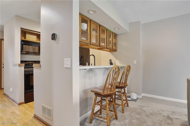2426 Wrens Dr S, Stow, OH 44224 - indoor wet bar featuring black microwave and baseboards