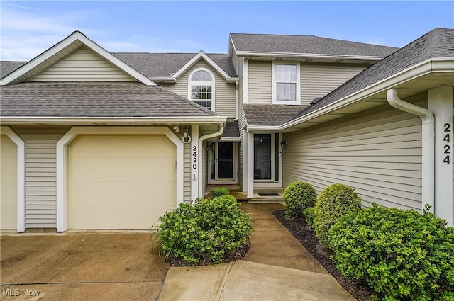 2426 Wrens Dr S, Stow, OH 44224 - view of front facade with roof with shingles, driveway, and an attached garage