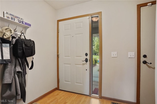 2426 Wrens Dr S, Stow, OH 44224 - entrance foyer featuring light wood-style flooring and baseboards