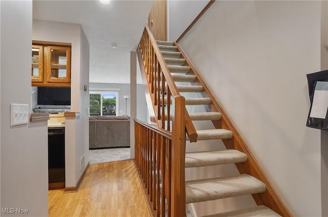 2426 Wrens Dr S, Stow, OH 44224 - stairway with wood finished floors and baseboards