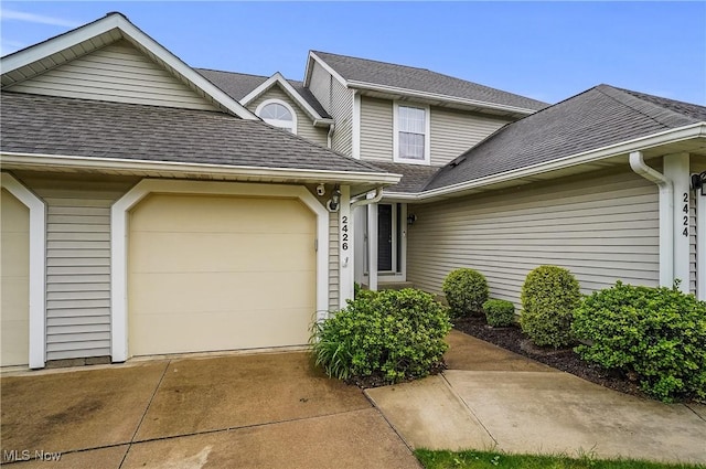 2426 Wrens Dr S, Stow, OH 44224 - traditional home with a shingled roof, an attached garage, and concrete driveway