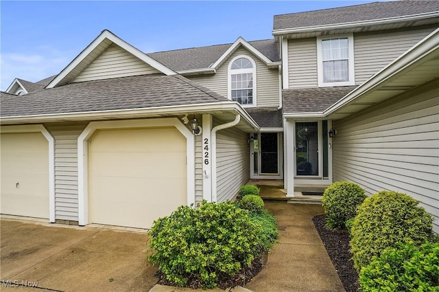 2426 Wrens Dr S, Stow, OH 44224 - entrance to property with roof with shingles, concrete driveway, and a garage