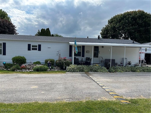 8452 E Bay Shore Rd Unit 7, Danbury, OH 43440 - view of front of house featuring covered porch