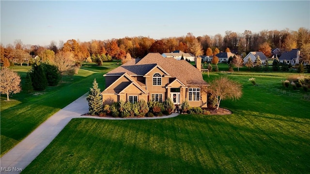 114 Mallard Creek Run, Lagrange, OH 44050 - view of front facade featuring a front lawn and a chimney