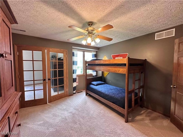 114 Mallard Creek Run, Lagrange, OH 44050 - carpeted bedroom with french doors, baseboards, a textured ceiling, and a ceiling fan