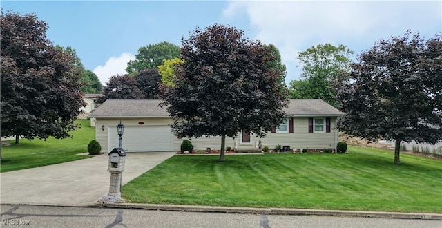215 Rhine St SW, Sugarcreek, OH 44681 - view of front of property featuring concrete driveway, a front yard, and an attached garage