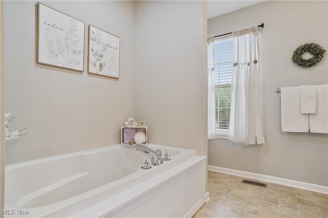 2215 Dorchester Dr, Kent, OH 44240 - bathroom featuring a garden tub and baseboards