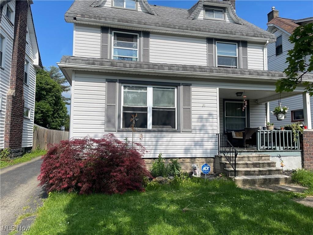 21 Summit Ave, Niles, OH 44446 - traditional style home featuring a porch and a front yard