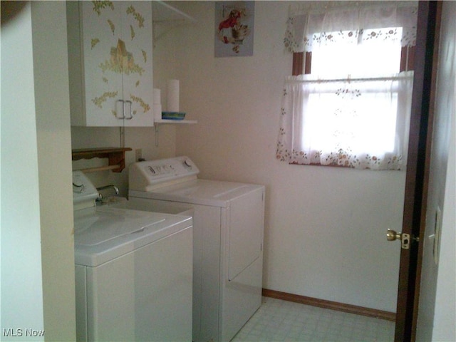 7251 Hidden Glen Dr, Amherst, OH 44001 - laundry room featuring separate washer and dryer, cabinet space, and light floors