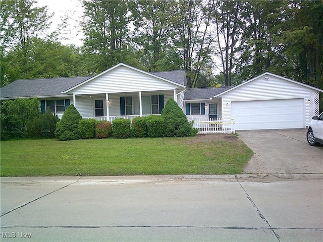 7251 Hidden Glen Dr, Amherst, OH 44001 - single story home with covered porch, a front lawn, driveway, and a garage