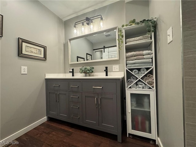 1226 16th St, Parkersburg, WV 26101 - full bath featuring double vanity, wood finished floors, and baseboards