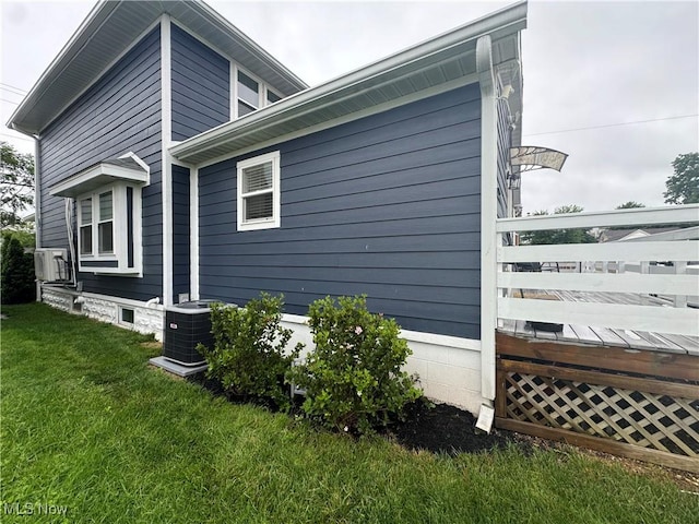 1226 16th St, Parkersburg, WV 26101 - view of home's exterior with a yard and central AC