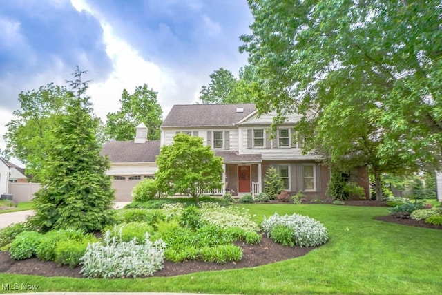 2872 Aylesbury St NW, North Canton, OH 44720 - view of front facade featuring a front yard and a garage