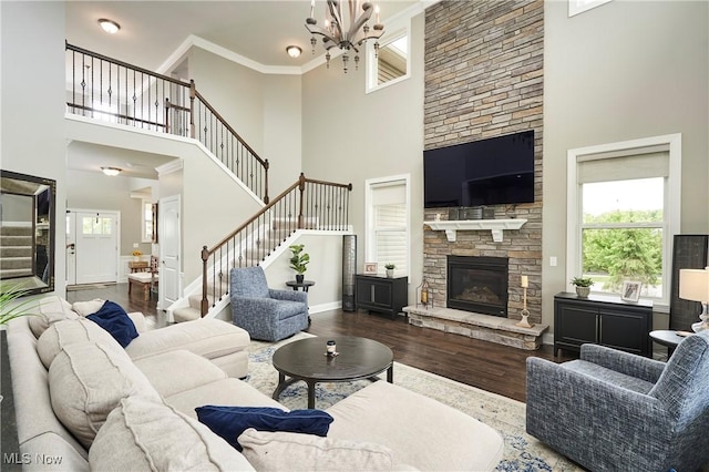 30 Harvester Dr, Copley, OH 44321 - living area with a towering ceiling, stairway, a chandelier, wood finished floors, and a fireplace