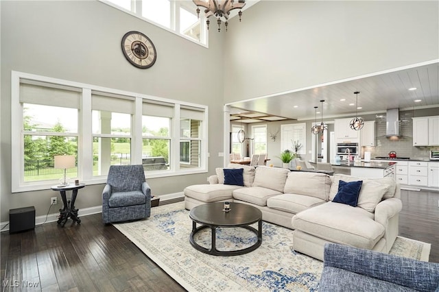 30 Harvester Dr, Copley, OH 44321 - living room featuring a chandelier, dark wood-type flooring, baseboards, recessed lighting, and a towering ceiling