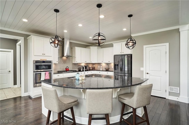 30 Harvester Dr, Copley, OH 44321 - kitchen featuring appliances with stainless steel finishes, dark wood finished floors, wall chimney range hood, baseboards, and recessed lighting