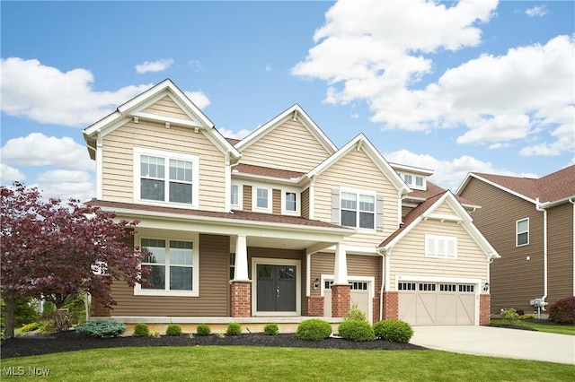 30 Harvester Dr, Copley, OH 44321 - craftsman-style home featuring driveway, brick siding, a garage, and a front lawn