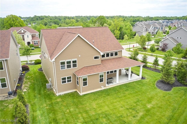30 Harvester Dr, Copley, OH 44321 - back of property with a patio area, a lawn, a residential view, and a shingled roof