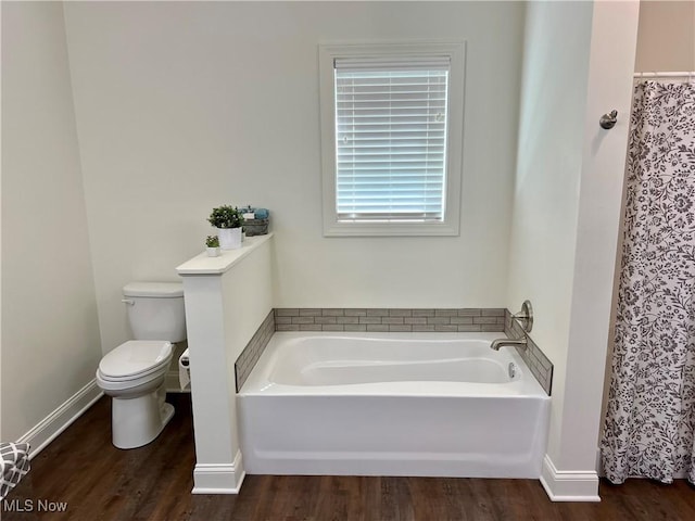 261 Valley View Dr, Weirton, WV 26062 - full bathroom featuring toilet, wood finished floors, a garden tub, and baseboards