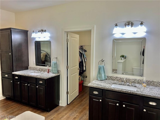 261 Valley View Dr, Weirton, WV 26062 - full bath with wood finished floors, two vanities, a spacious closet, and baseboards