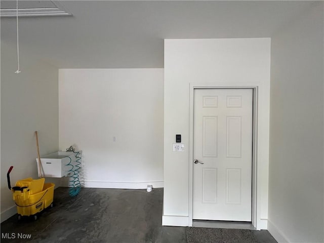 261 Valley View Dr, Weirton, WV 26062 - spare room with attic access, baseboards, and concrete floors
