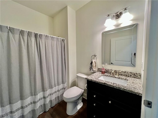 261 Valley View Dr, Weirton, WV 26062 - bathroom featuring toilet, vanity, wood finished floors, baseboards, and a shower with shower curtain