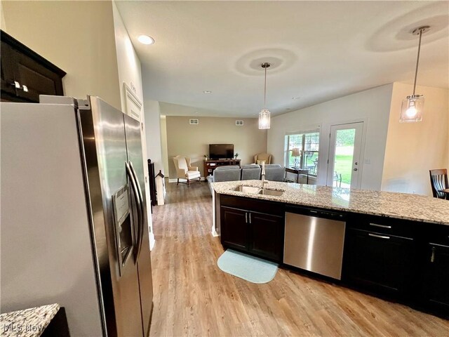 261 Valley View Dr, Weirton, WV 26062 - kitchen with appliances with stainless steel finishes, a sink, light wood-style floors, light stone counters, and hanging light fixtures