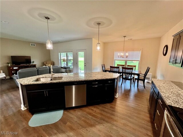 261 Valley View Dr, Weirton, WV 26062 - kitchen with wood finished floors, a center island with sink, a sink, and stainless steel appliances