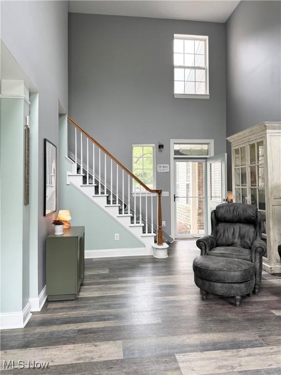 73 Falls River Dr Unit 6, Munroe Falls, OH 44262 - foyer featuring a high ceiling, wood finished floors, stairway, and baseboards