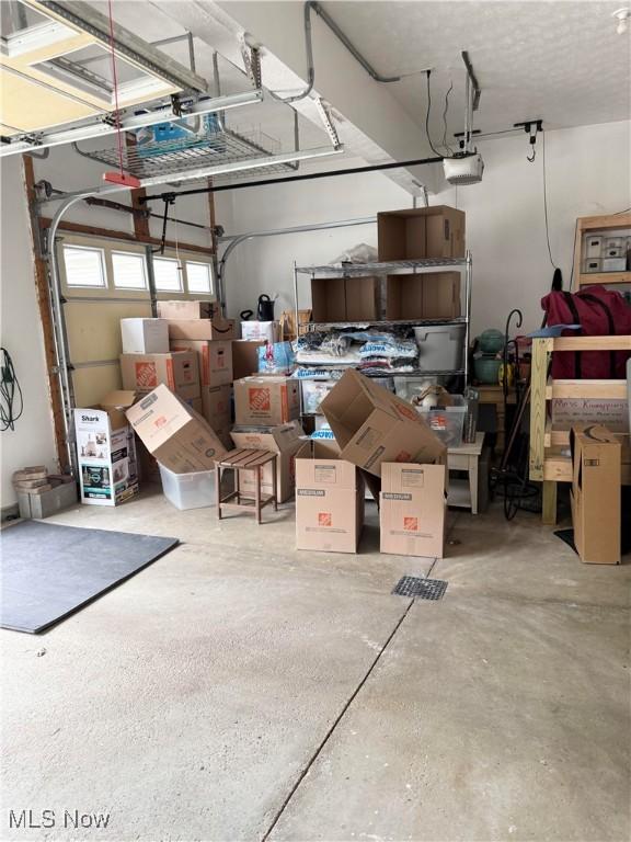 73 Falls River Dr Unit 6, Munroe Falls, OH 44262 - garage with a garage door opener