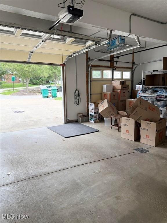 73 Falls River Dr Unit 6, Munroe Falls, OH 44262 - garage featuring a garage door opener