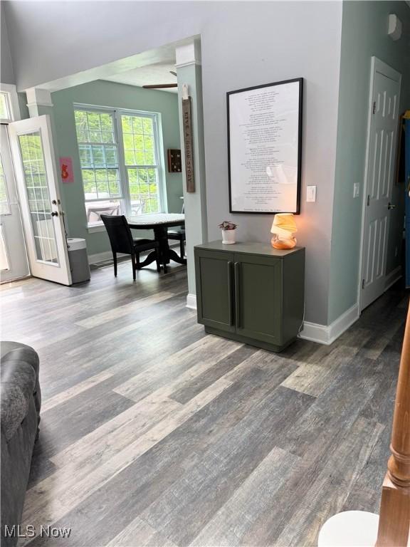 73 Falls River Dr Unit 6, Munroe Falls, OH 44262 - living area featuring wood finished floors, baseboards, and ceiling fan