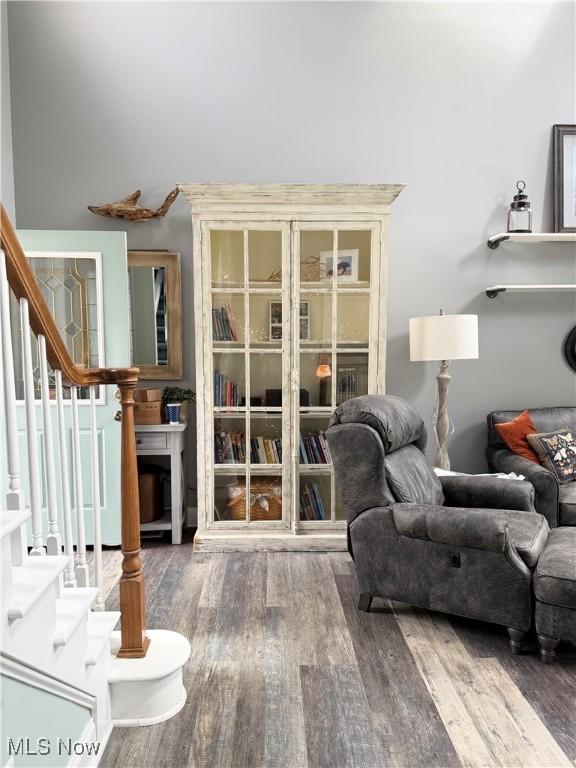 73 Falls River Dr Unit 6, Munroe Falls, OH 44262 - sitting room with wood finished floors and stairs